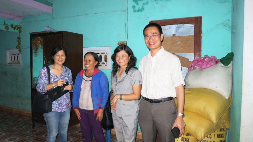 Ms. Phan Thi Lan—owner of a storm resistant house shares her satisfaction of her house standing strong after Typhoon Nari swept through Da Nang the day before in 2013. This is one of many houses under the Storm Resistant Housing for a Resilient Da Nang City project. After the typhoon, there was no damage to any of the 244 beneficiary households who had finished their house construction/retrofitting at the time.